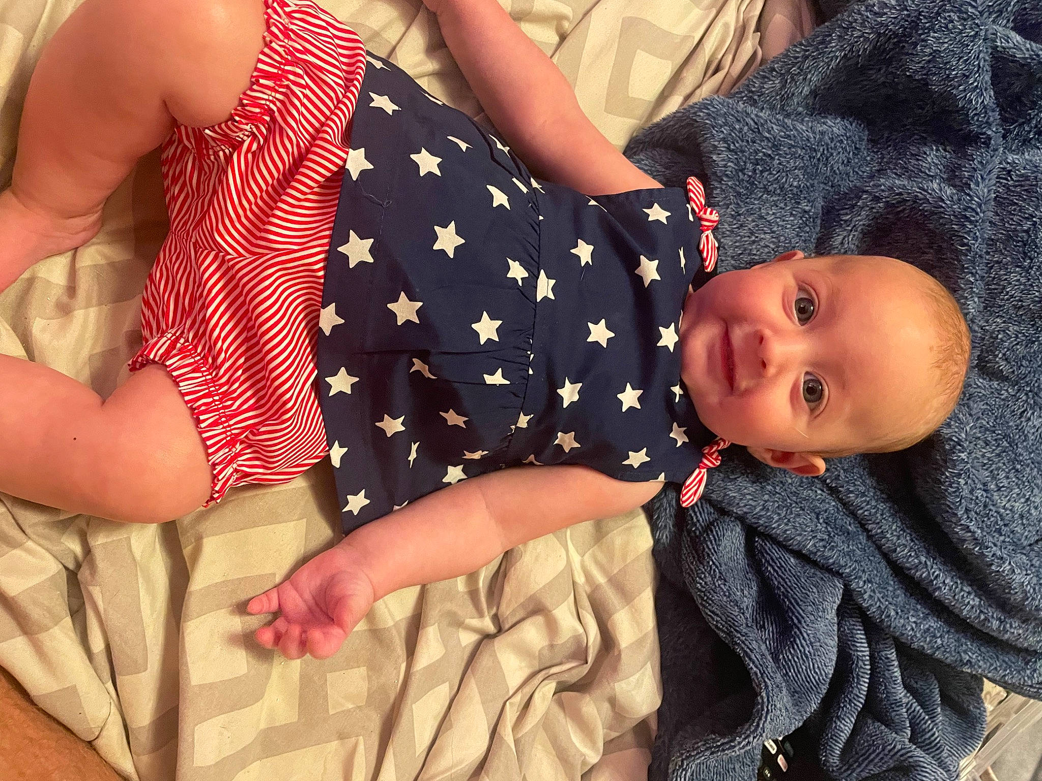 Brynlee joined the competition — help win amazing prizes! baby, baby_products, baby_sleeping, baby_toddler_clothing, child, comfort, elbow, fun, gesture, happy, human_leg, linens, nail, pattern, person, sitting, skin, sleeve, textile, thigh