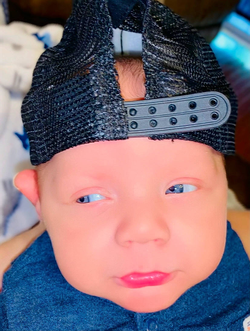 Judson is registered to the contest to win money with this photo: baby_toddler_clothing, beauty, blue, cap, cool, costume_hat, electric_blue, eye, eyebrow, eyelash, happy, headgear, headwear, lip, neck, pattern, person, photograph, pink, street_fashion