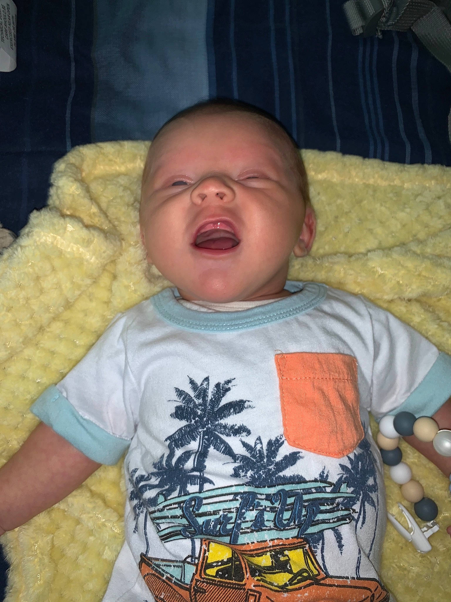 Judson is registered to the contest to win money with this photo: baby, baby_toddler_clothing, cheek, child, chin, comfort, cool, eye, finger, forehead, hair, iris, linens, mouth, nose, person, skin, sleeve, t_shirt, toddler