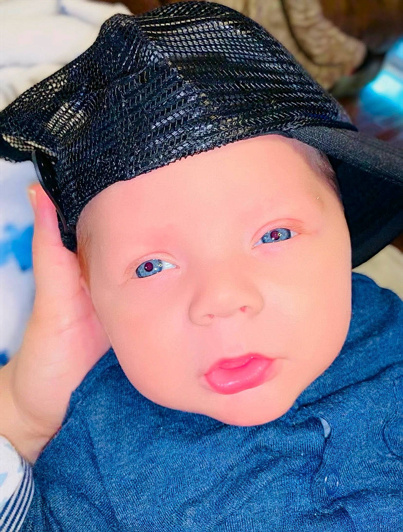 Judson is registered to the contest to win money with this photo: azure, baby, baby_toddler_clothing, beauty, blue, cap, cheek, chin, clothing, electric_blue, eyebrow, eyelash, hat, headgear, headwear, lip, person, product, skin, sleeve