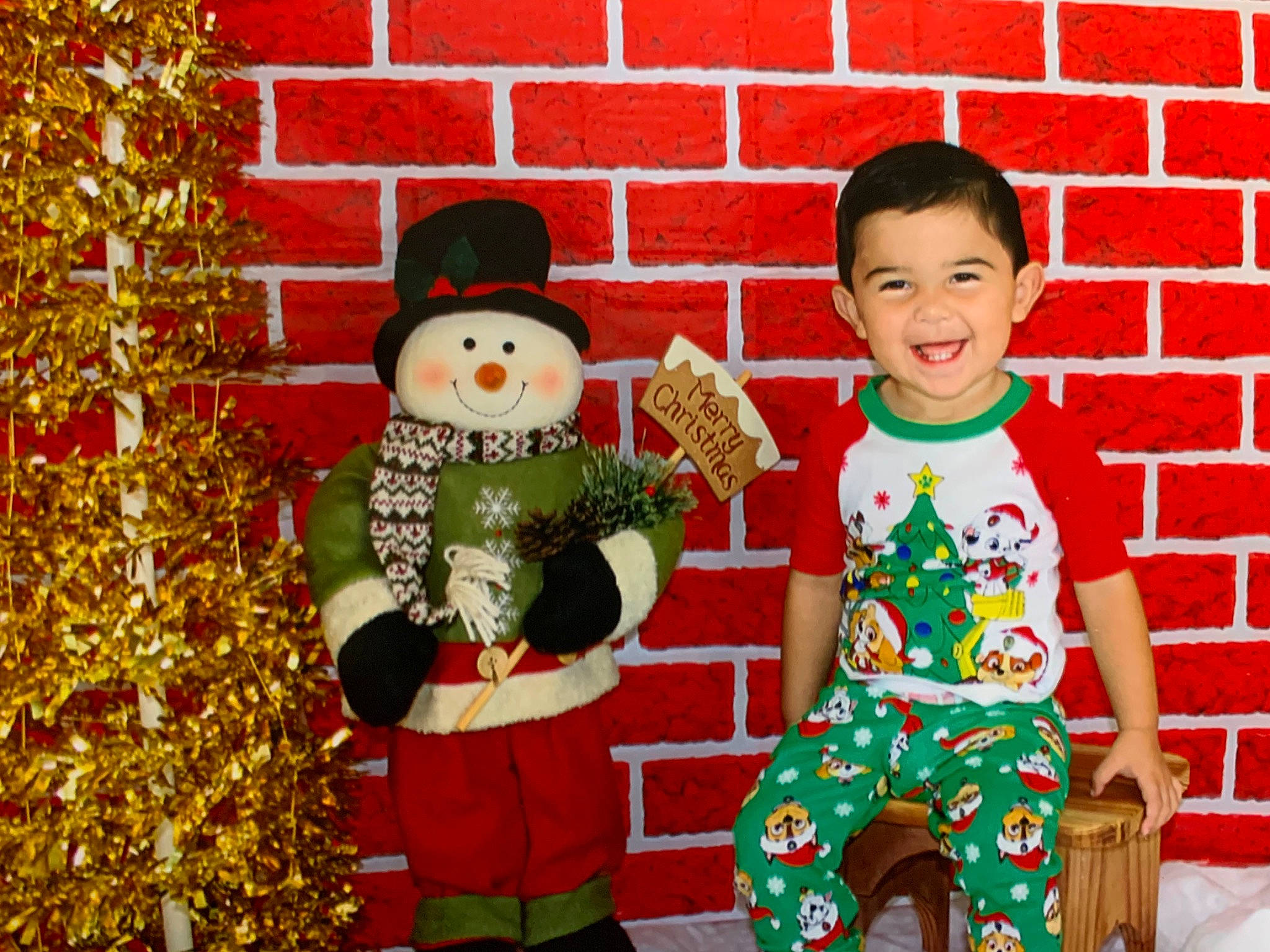Graysen is registered to the contest to win money with this photo: child, christmas, christmas_decoration, christmas_eve, christmas_ornament, christmas_tree, event, fictional_character, happy, holiday, holiday_ornament, interior_design, joy, person, toddler