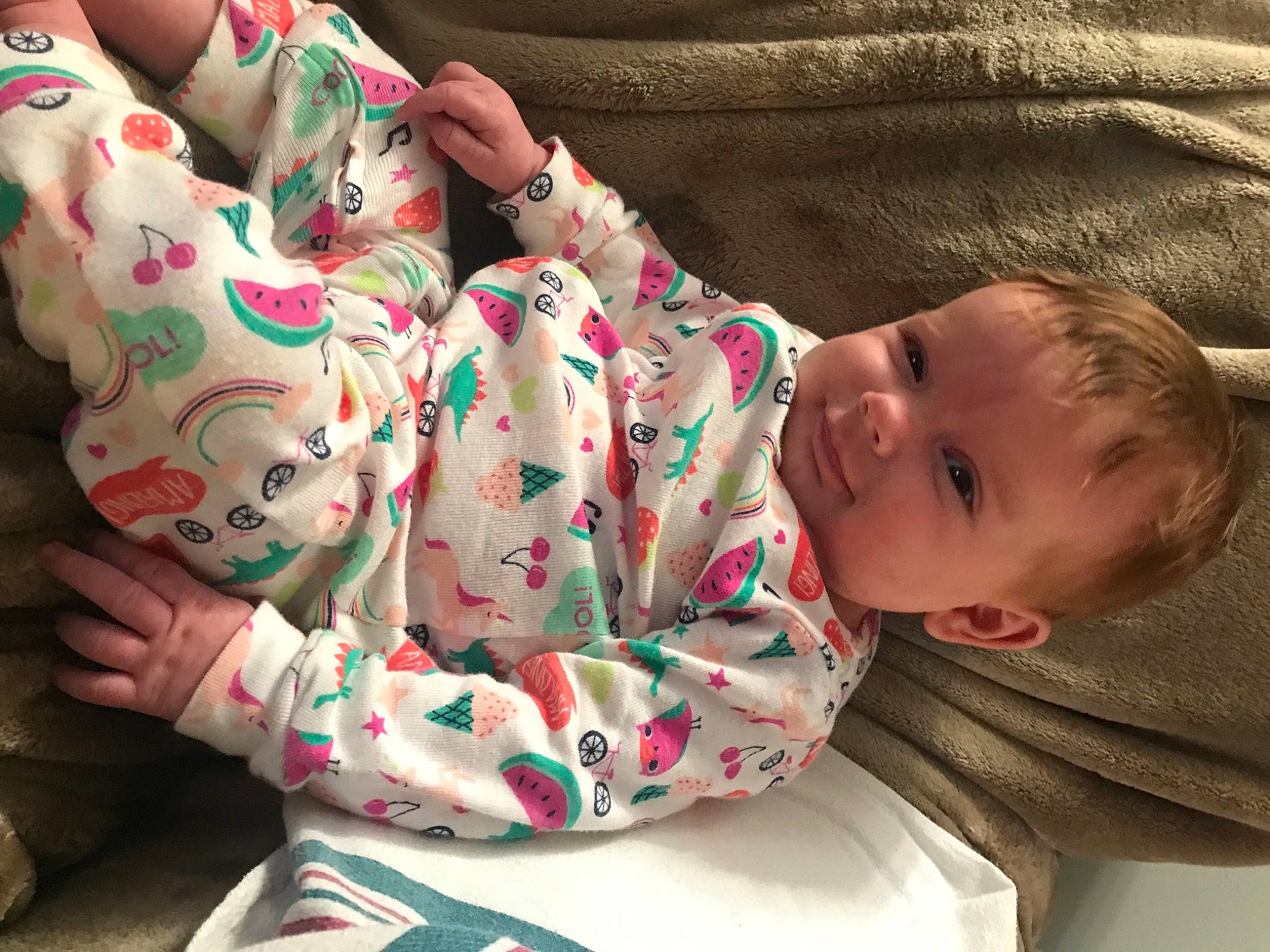 Joanna is registered to the contest to win money with this photo: baby, baby_toddler_clothing, cheek, chin, comfort, eye, hand, head, human_body, lip, mammal, mouth, neck, nose, person, product, skin, sleeve, smile, textile