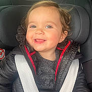 Gabriella a rejoint le concours — aidez-le/la à gagner de superbes lots ! baby, car, car_seat, casual, child, clothing, cute, face, hair, happy, indoors, jacket, person, portrait, safety, seat, seatbelt, smiling, toddler, warm