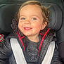 baby, car, car_seat, casual, child, clothing, cute, face, hair, happy, indoors, jacket, person, portrait, safety, seat, seatbelt, smiling, toddler, warm