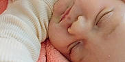 Journey is registered to the contest to win money with this photo: baby, sleeping, infant, blanket, pink, cozy, face, closed_eyes, soft, clothing, cute, peaceful, skin, portrait, child, newborn, resting, comfort, warm, toddler