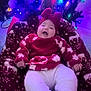 Journey is registered to the contest to win money with this photo: baby, blanket, candy_cane, celebration, child, christmas_lights, christmas_tree, cozy, decorations, festive, happy, headband, holiday, indoors, infant, red_clothing, reindeer_pattern, seasonal, smiling, white_pants