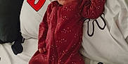 Journey is registered to the contest to win money with this photo: baby, sleeping, onesie, maroon, stars, moons, blanket, puzzle_piece, pacifier, infant, cozy, peaceful, bed, child, footed_pajamas, resting, cute, indoors, soft, young