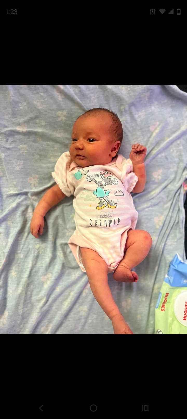 Journey joined the competition — help win amazing prizes! baby, infant, onesie, pink_clothing, blanket, lying_down, cute, newborn, cartoon_print, soft_texture, pastel_colors, sleepwear, small_hands, small_feet, indoors, child, face, person, resting, huggies_wipes