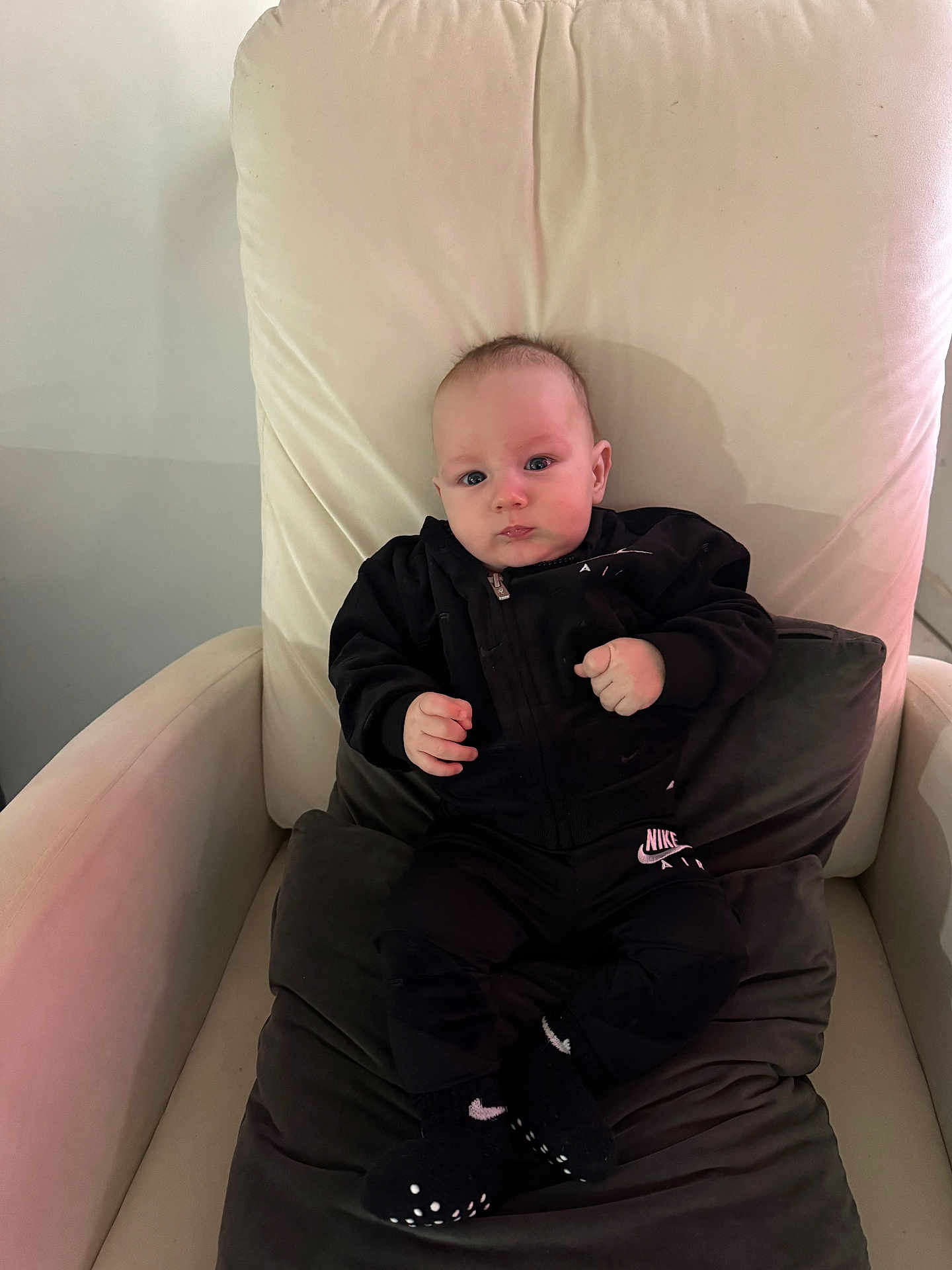 Axel Gael Morera joined the competition — help win amazing prizes! baby, infant, child, armchair, chair, cushion, pillow, black_clothing, hoodie, nike, brand_logo, socks, grip_socks, portrait, indoors, skin, face, hands, eyes, cute