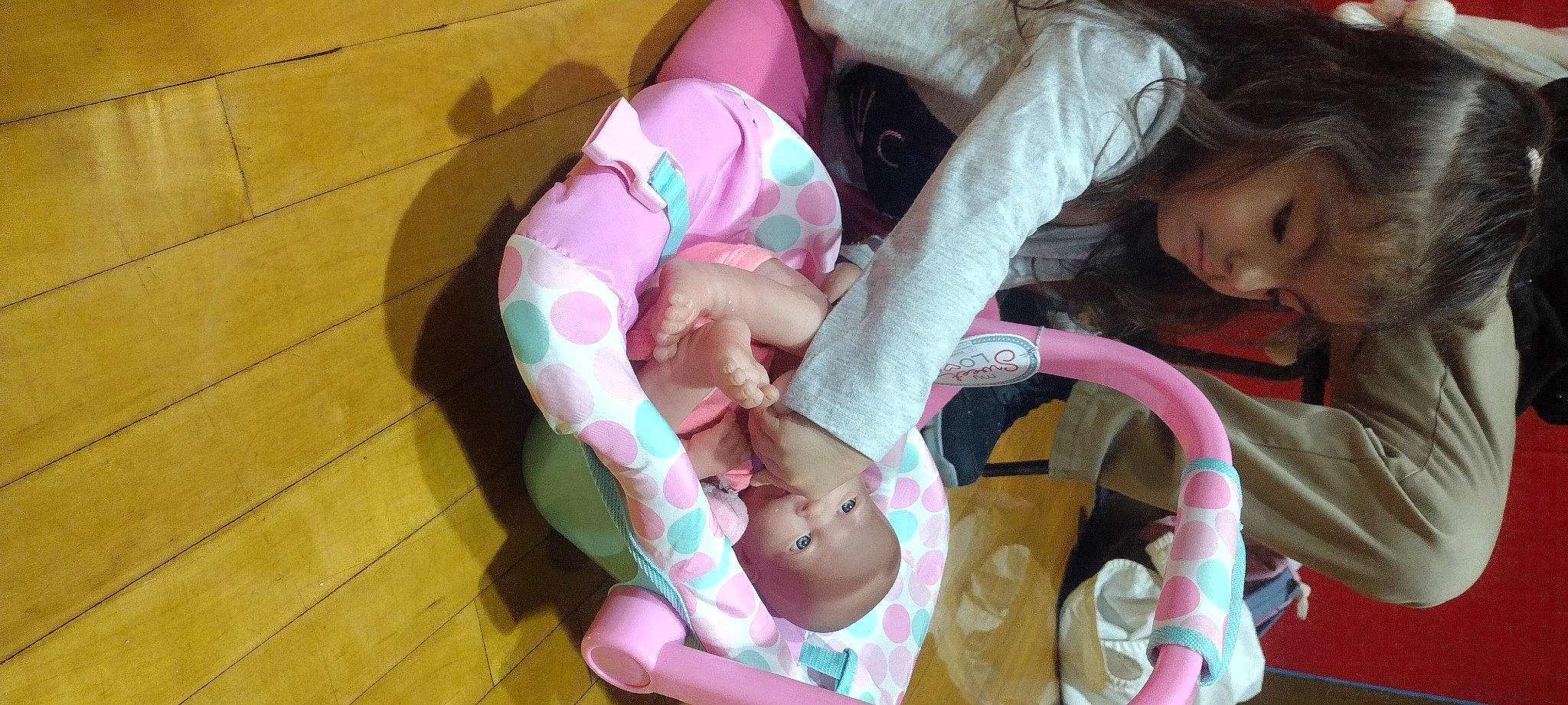 Natalie is registered to the contest to win money with this photo: arm, baby, baby_products, baby_safety, baby_toddler_clothing, cheek, child, clothing, comfort, eye, face, fun, head, infant_bed, person, pink, room, skin, sock, thigh