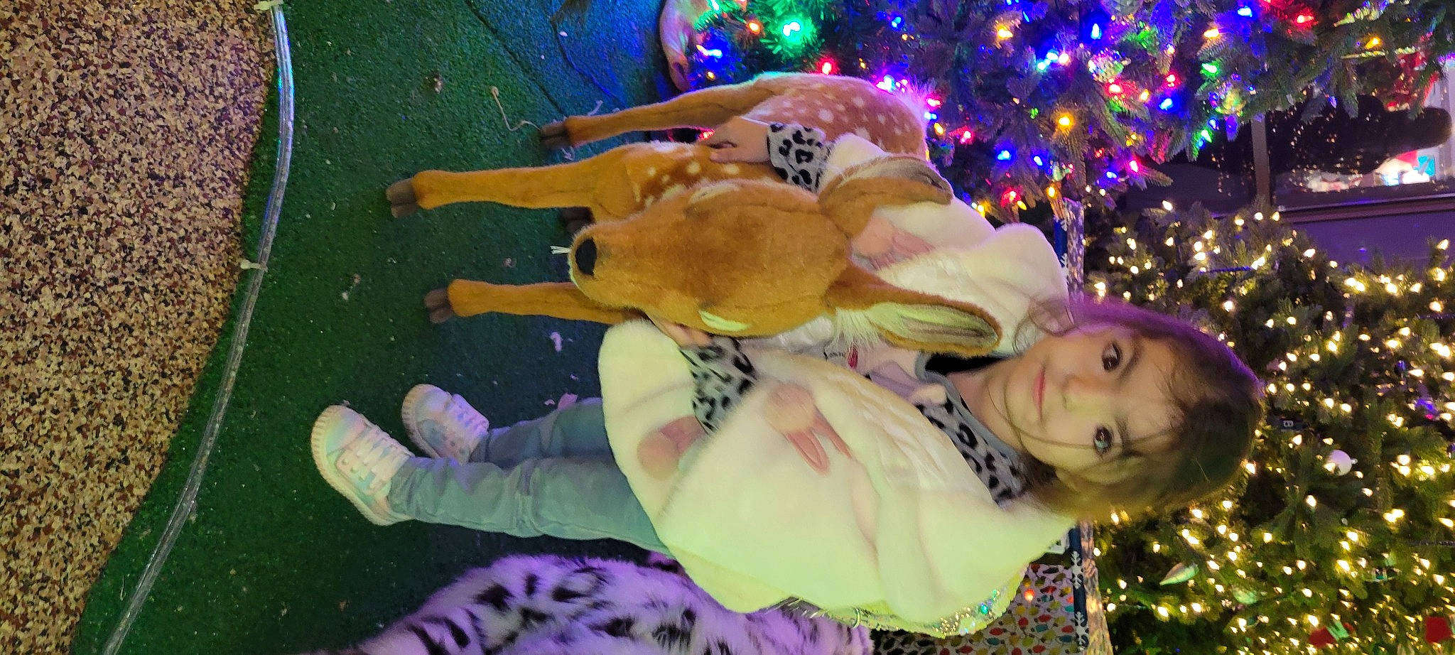 Natalie joined the competition — help win amazing prizes! christmas, christmas_decoration, christmas_eve, christmas_ornament, christmas_tree, event, fawn, fun, green, happy, holiday, leisure, ornament, person, photograph, pink, plant, purple, snapshot, toddler