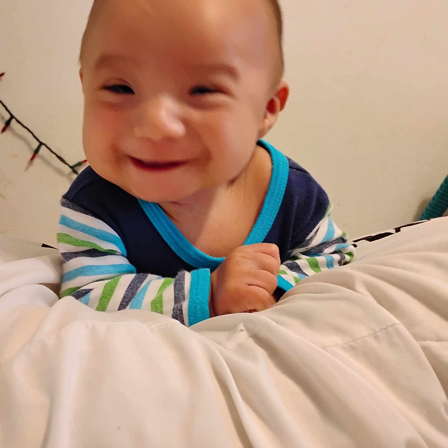 Way joined the competition — help win amazing prizes! baby, bedroom, blanket, cheerful, child, cozy, cute, face, hand, happy, head, indoor, infant, person, portrait, smile, soft, striped_clothing, warm_light, young