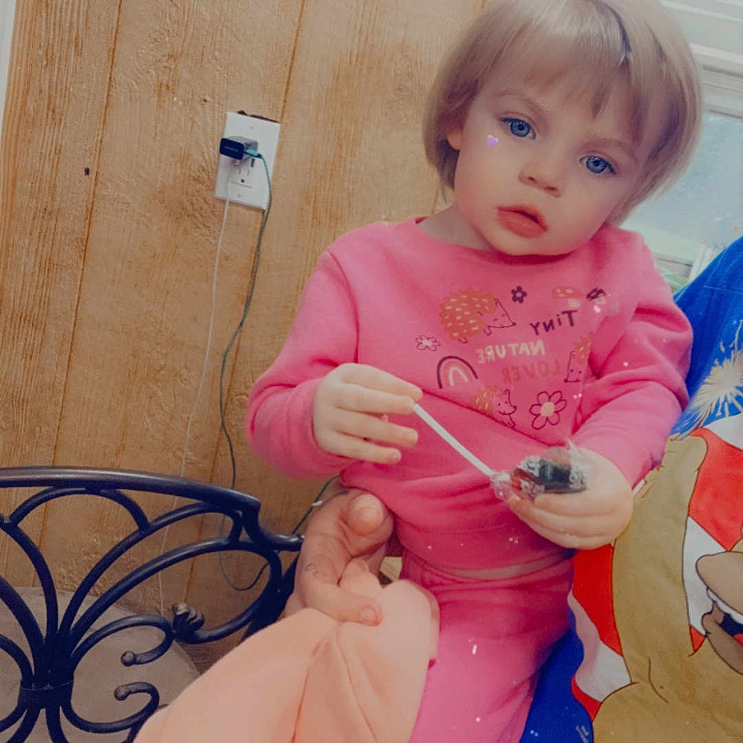 Emery is registered to the contest to win money with this photo: baby, bodypart, closet, couch, cupboard, cutlery, face, finger, food, furniture, hand, hardwood, head, indoors, person, photography, plywood, portrait, spoon, wood