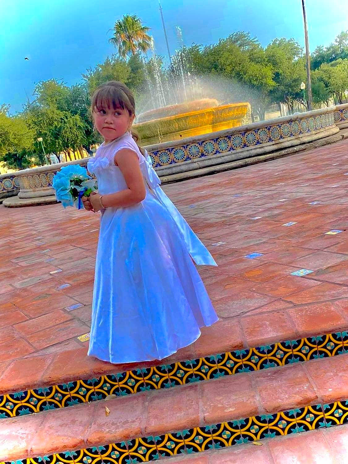 Arianna is registered to the contest to win money with this photo: bridal_party_dress, dress, electric_blue, event, facial_expression, flash_photography, flooring, formal_wear, fun, gown, happy, landscape, leisure, people_in_nature, person, recreation, sky, toddler, travel, tree