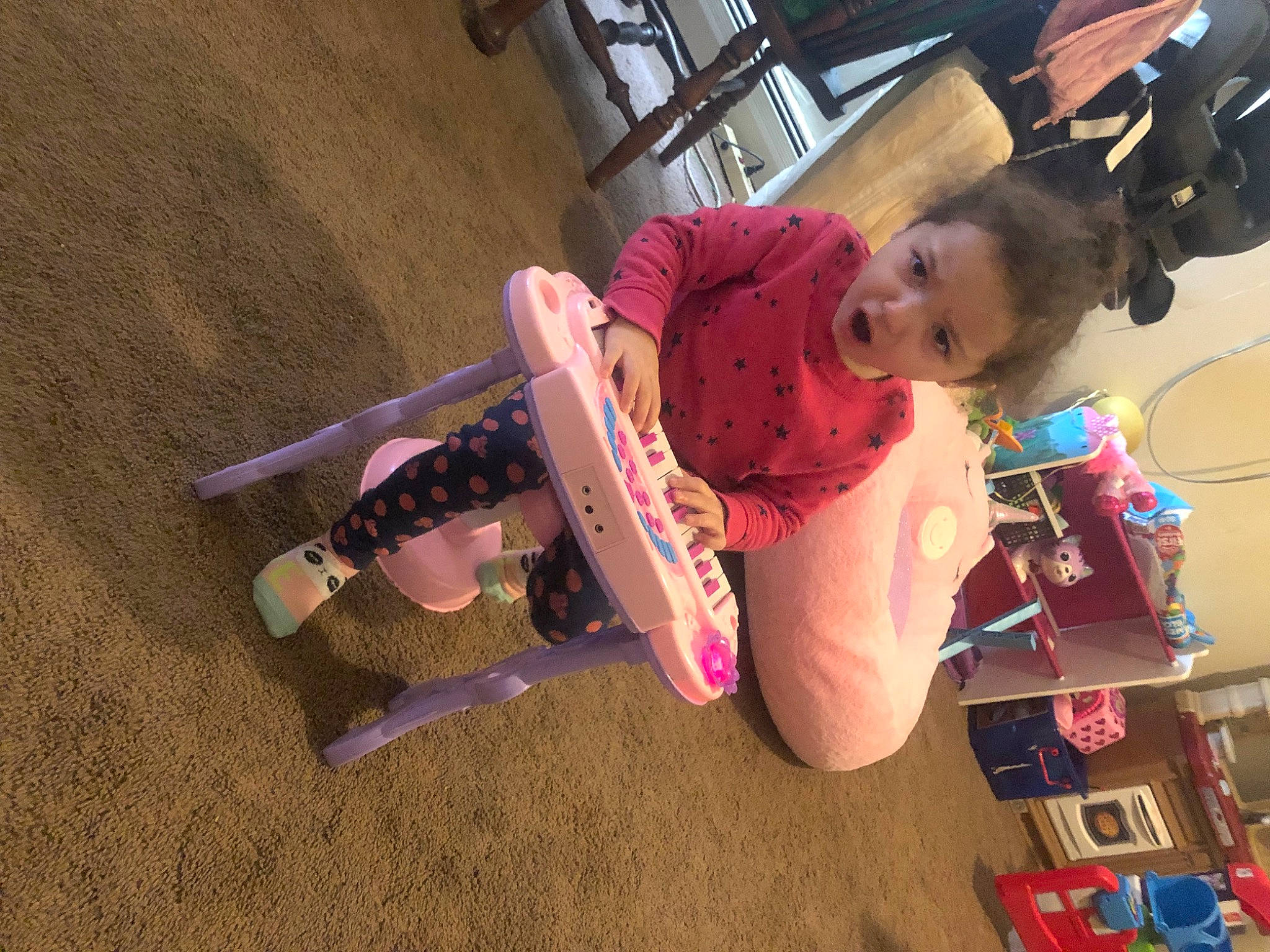 Faith joined the competition — help win amazing prizes! baby, baby_products, baby_toys, carmine, child, flooring, fun, leisure, magenta, person, pink, play, riding_toy, room, sock, stuffed_toy, surprise, toddler, toy, toy_vehicle