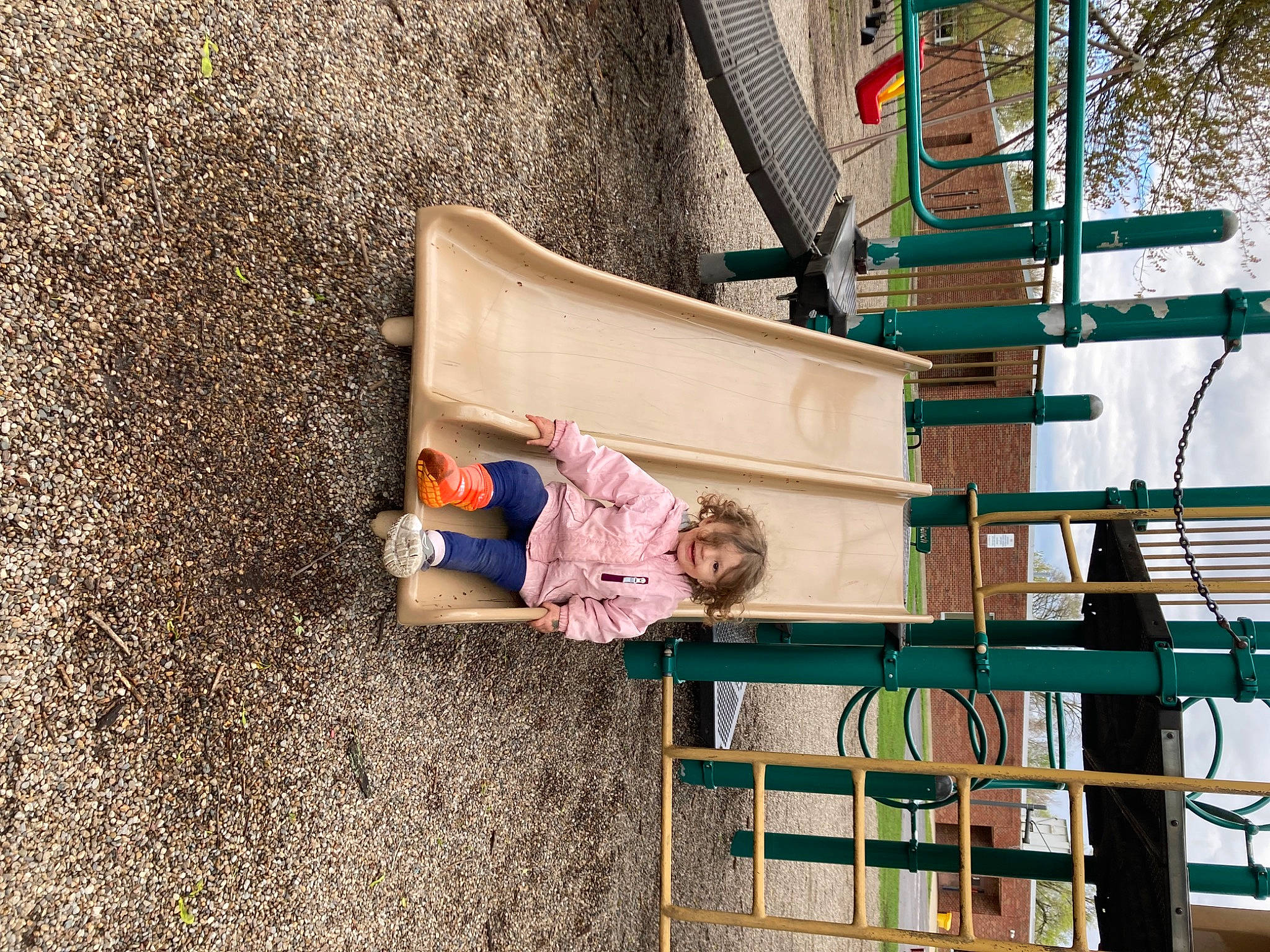 Avery is registered to the contest to win money with this photo: child, city, concrete, facade, fun, joy, leisure, metal, person, play, playground, recreation, sitting, soil, street, toddler, tree, vacation, wood