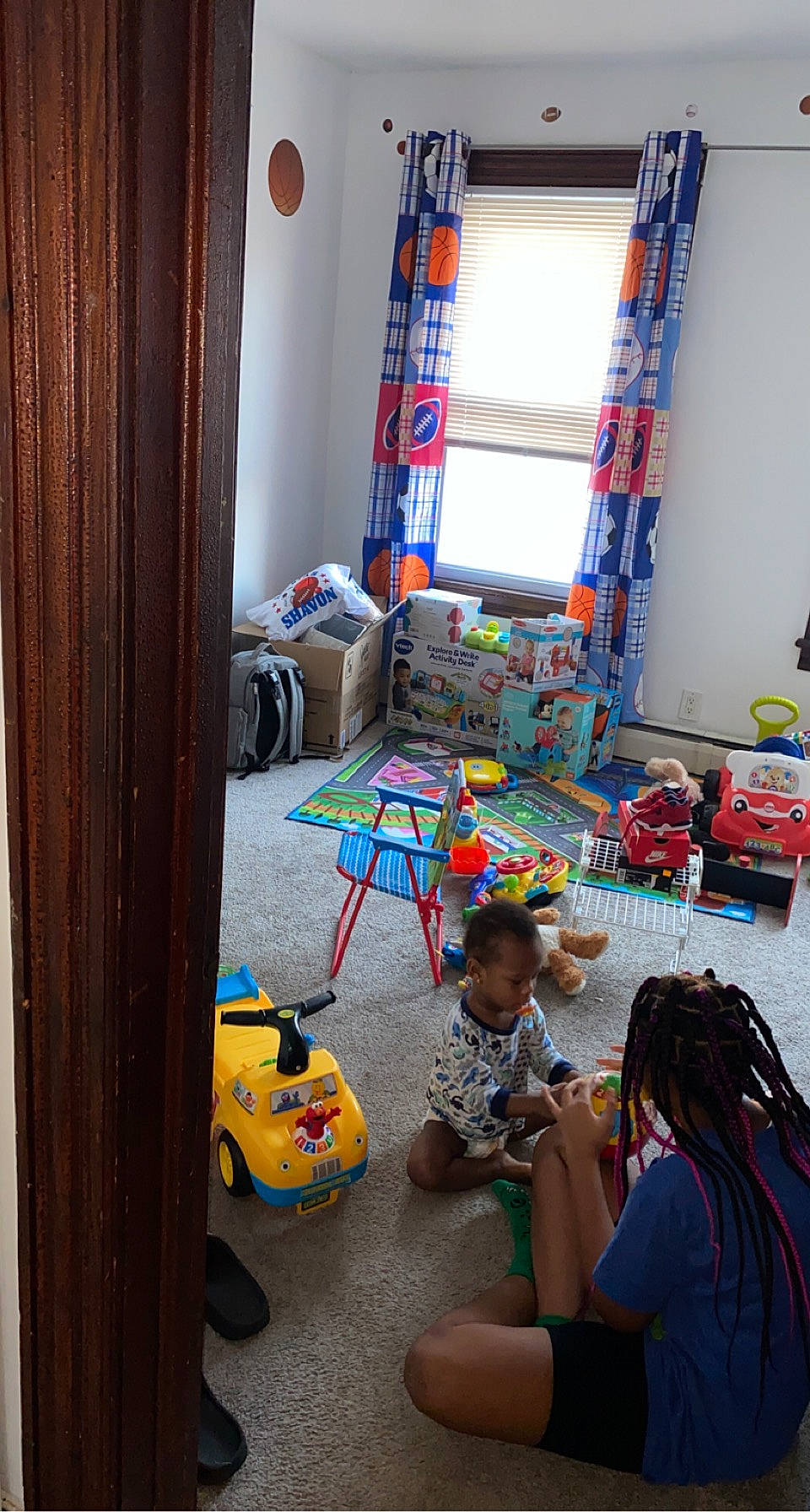 Shavon is registered to the contest to win money with this photo: baby_toys, creative_arts, curtain, linens, person, plastic, play, textile, toy, toy_vehicle, window_treatment