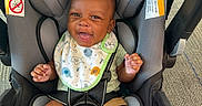 Kyrie Parker is registered to the contest to win money with this photo: baby, car_seat, smile, bib, infant, seatbelt, child, happy, cute, foot, clothing, indoor, person, safety, head, skin, baby_boy, seat, photography, car_seat_strap