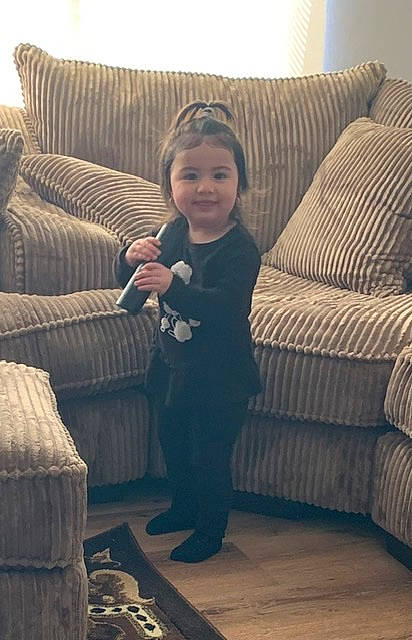 Aliyana joined the competition — help win amazing prizes! chair, child, comfort, couch, furniture, home, interior_design, joy, leg, person, play, room, sitting, slipcover, sofa_bed, toddler, wood