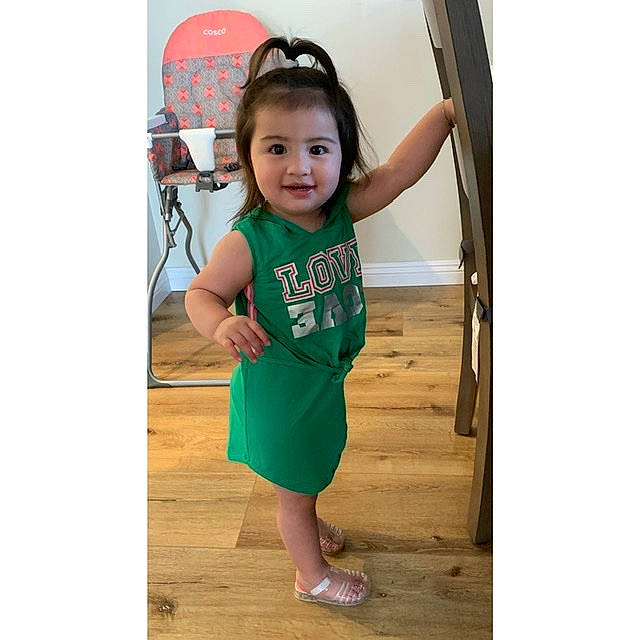 Aliyana is registered to the contest to win money with this photo: baby, beauty, child, child_model, clothing, dress, green, happy, joy, outerwear, person, play, shoe, sleeve, smile, t_shirt, toddler