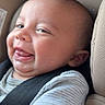baby, infant, car_seat, smile, tongue_out, child, seatbelt, clothing, striped_shirt, closeup, cute, happy, expression, face, skin, head, arm, indoors, safety, person