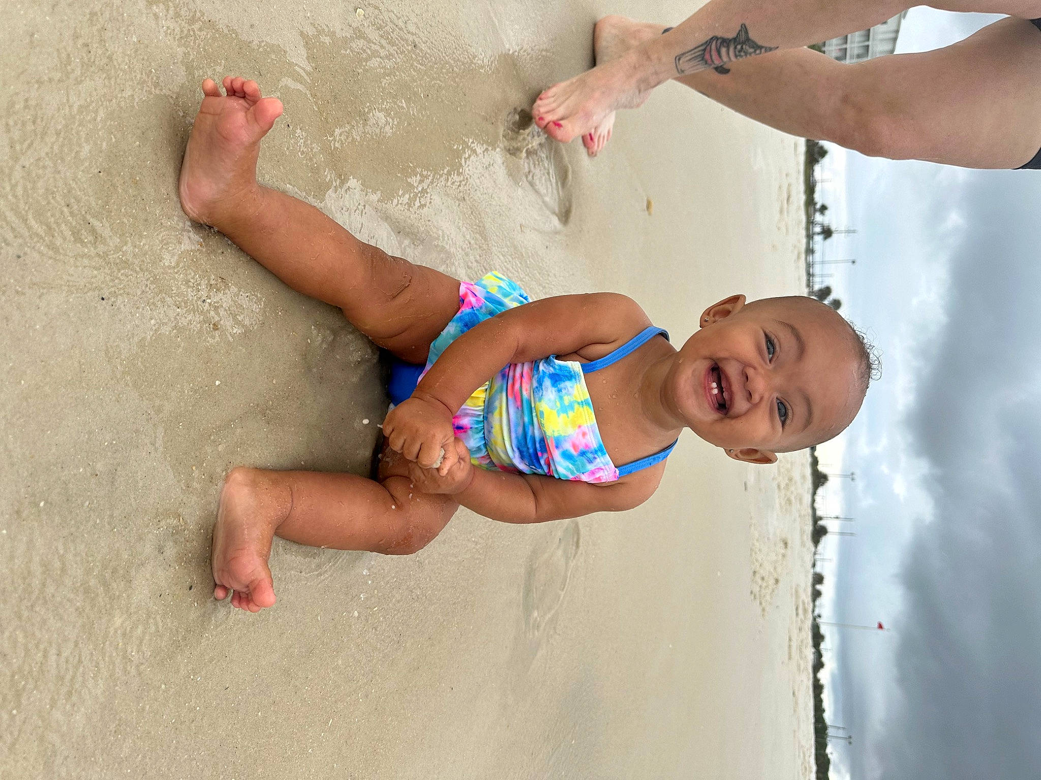 Giavanna joined the competition — help win amazing prizes! arm, barefoot, beach, body_of_water, chest, child, elbow, fun, hand, happy, human_leg, leg, leisure, people_on_beach, person, smile, swimwear, thigh, toddler, trunk