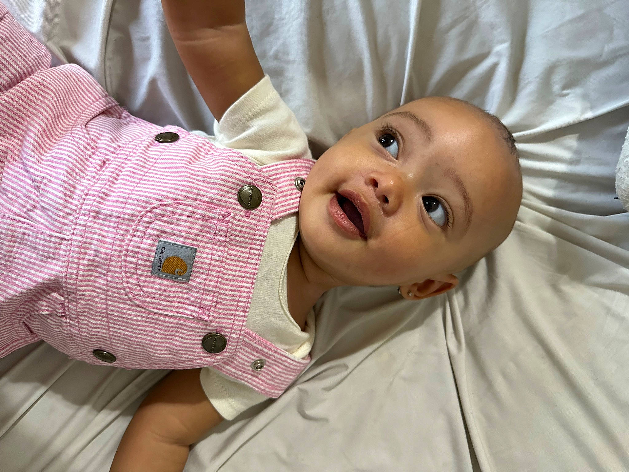 Giavanna is registered to the contest to win money with this photo: baby, baby_products, baby_toddler_clothing, cheek, child, comfort, dress_shirt, gesture, happy, linens, lip, mouth, nose, pattern, person, plaid, skin, sleeve, smile, textile