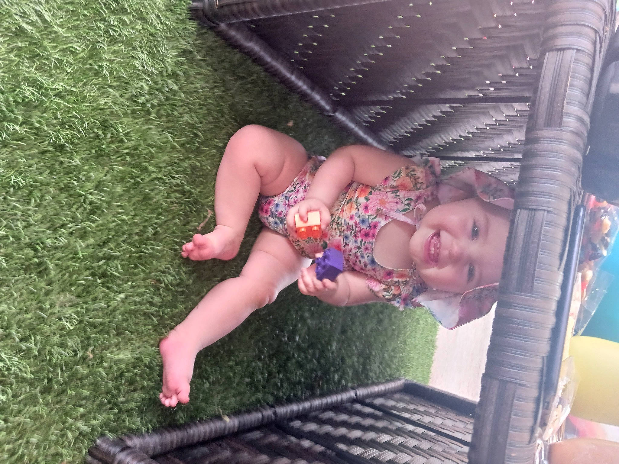 Julia joined the competition — help win amazing prizes! baby, baby_toddler_clothing, barefoot, child, foot, fun, grass, happy, headwear, human_body, human_leg, joy, leg, leisure, outdoor_furniture, people_in_nature, person, recreation, sandal, sitting