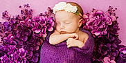 Sierra is registered to the contest to win money with this photo: baby, newborn, sleeping, flower_headband, purple_blanket, purple_flowers, pink_background, peaceful, wrapped, infant, cute, soft_texture, portrait, closeup, adorable, resting, baby_boy, baby_girl, tender, calm