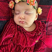 Lahna a rejoint le concours — aidez-le/la à gagner de superbes lots ! adorable, baby, blanket, child, closeup, cozy, cute, flower_headband, indoor, infant, peace, peaceful, plush, portrait, red_dress, resting, sleeping, soft_texture, velvet, young