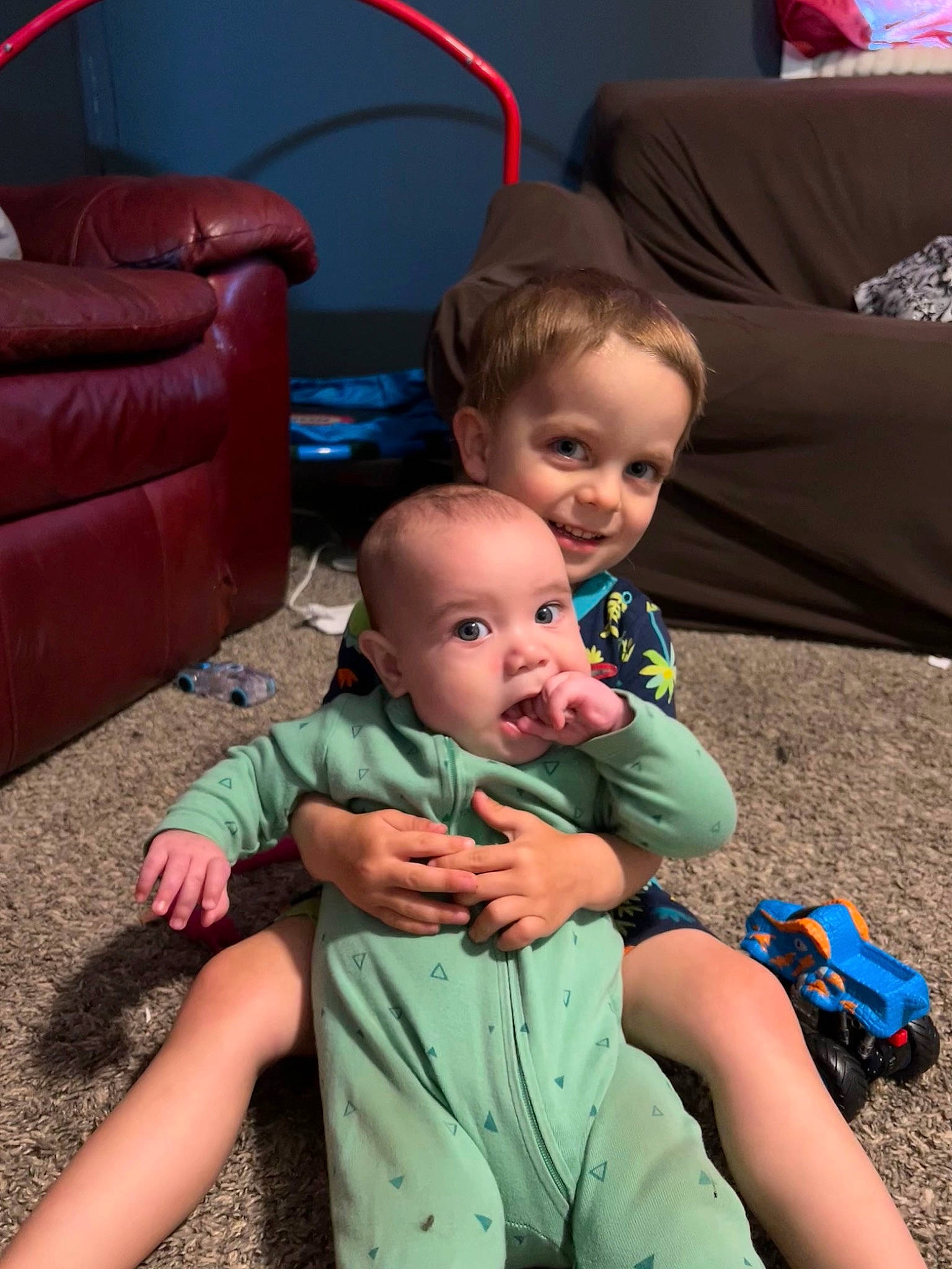 Holden is registered to the contest to win money with this photo: baby, baby_toddler_clothing, blue, child, comfort, fun, grass, green, hairstyle, happy, joy, lap, leg, leisure, living_room, people, person, photograph, skin, smile