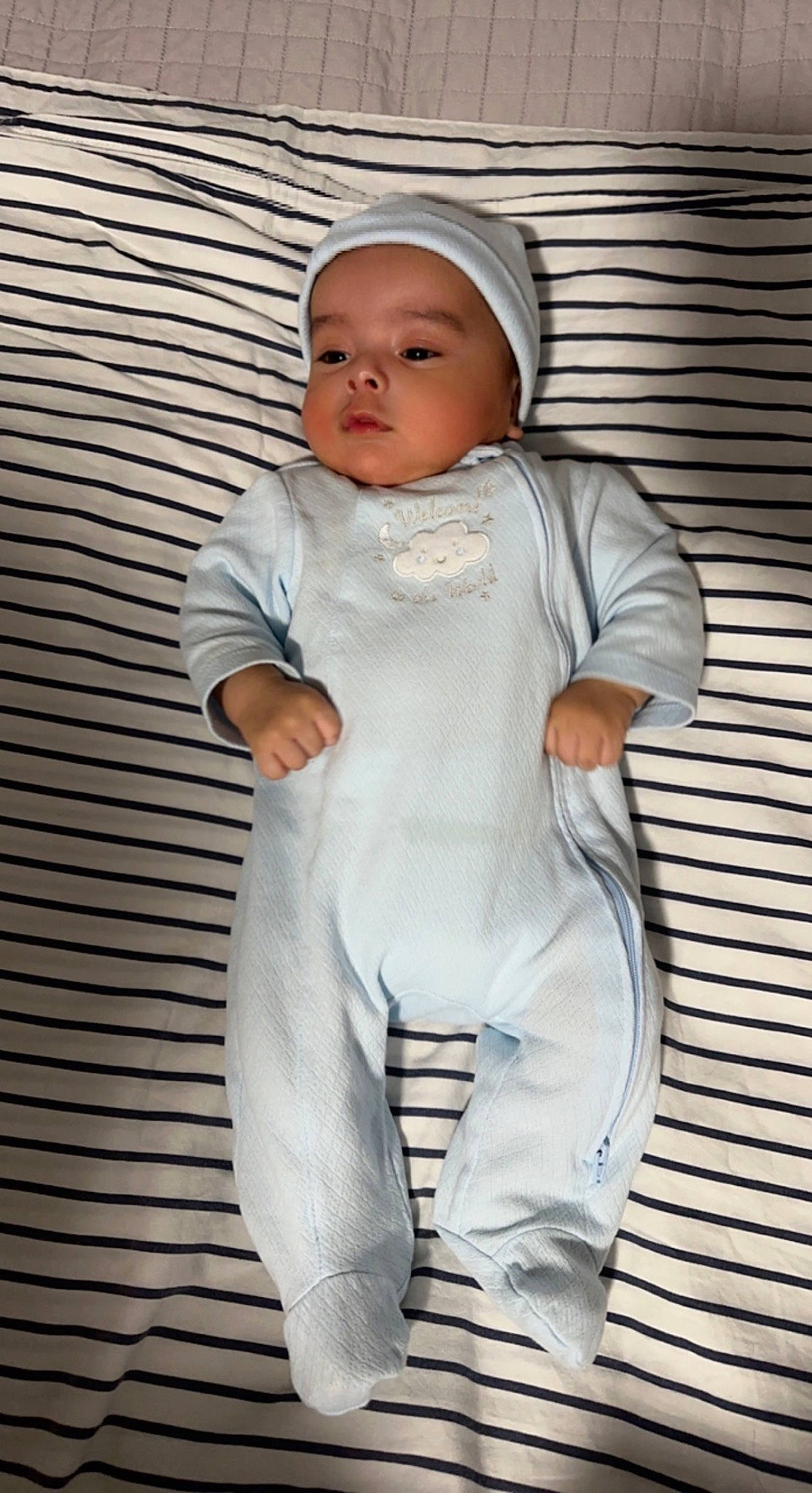 Milan is registered to the contest to win money with this photo: baby, baby_products, baby_toddler_clothing, beanie, cap, child, fashion_design, formal_wear, fur, gesture, happy, headgear, headwear, overall, pattern, peach, person, personal_protective_equipment, portrait_photography, sleeve