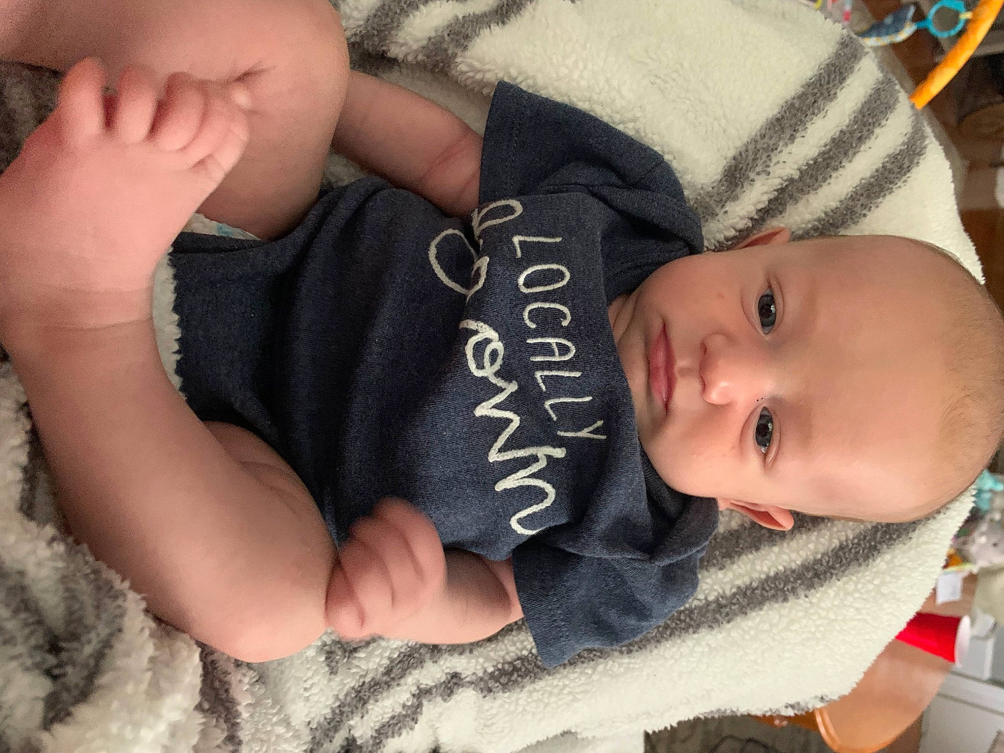 Evander joined the competition — help win amazing prizes! arm, baby, baby_toddler_clothing, cheek, child, comfort, eye, finger, gesture, hand, head, mammal, mouth, nail, person, skin, sleeve, smile, thumb, toddler