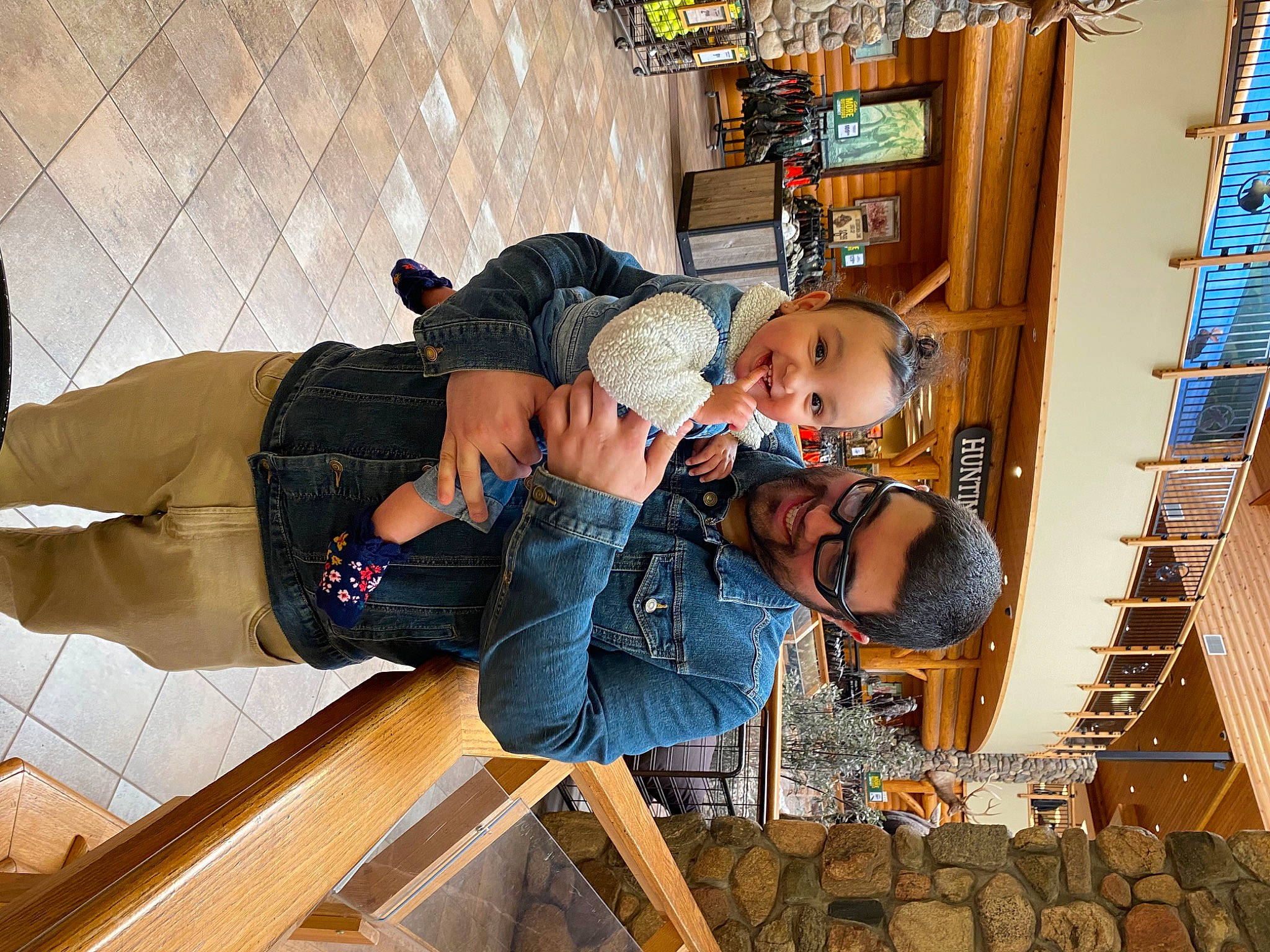 Nova is registered to the contest to win money with this photo: baby, bag, child, eyewear, fun, hat, joy, leisure, luggage_and_bags, person, sitting, temple, toddler, tourism, travel, vacation, wood, world