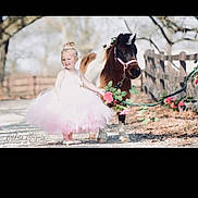 Chevelle joined the competition — help win amazing prizes! child, girl, pony, animal, dress, tutu, flowers, outdoor, nature, fence, tree, sunlight, portrait, cute, smile, pet, grass, pastel_colors, happy, fairytale