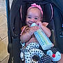 Zen joined the competition — help win amazing prizes! baby, infant, car_seat, bottle, smiling, headband, toy, plush, black, white, polka_dot, pink, happy, cute, indoor, child, seatbelt, floor, person, holding