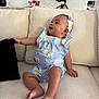 Zen joined the competition — help win amazing prizes! baby, child, couch, indoor, smiling, blue_outfit, daisies, headband, barefoot, furniture, living_room, pillow, guitar, artwork, happy, portrait, sitting, skin, person, home