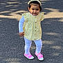 toddler, child, yellow_checkered, headband, pink_shoes, white_leggings, outdoor, pavement, sunlight, shadow, cute, walking, happy, person, young_child, casual_clothing, daytime, smiling, fashion, playful