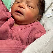 Ahnaf joined the competition — help win amazing prizes! newborn, baby, infant, sleeping, blanket, pink_clothing, portrait, closeup, face, soft_texture, cozy, wrapped, child, peaceful, indoors, human, skin, cute, resting, young