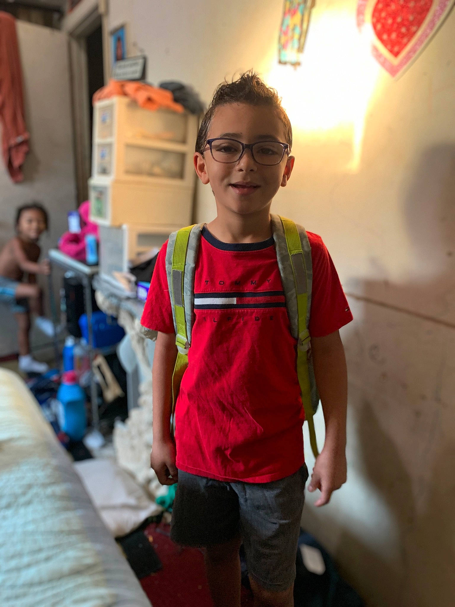 John joined the competition — help win amazing prizes! bag, blurred, ceiling, child, eyewear, flooring, fun, glasses, happy, joy, leisure, luggage_and_bags, person, personal_protective_equipment, recreation, room, shorts, smile, standing, t_shirt