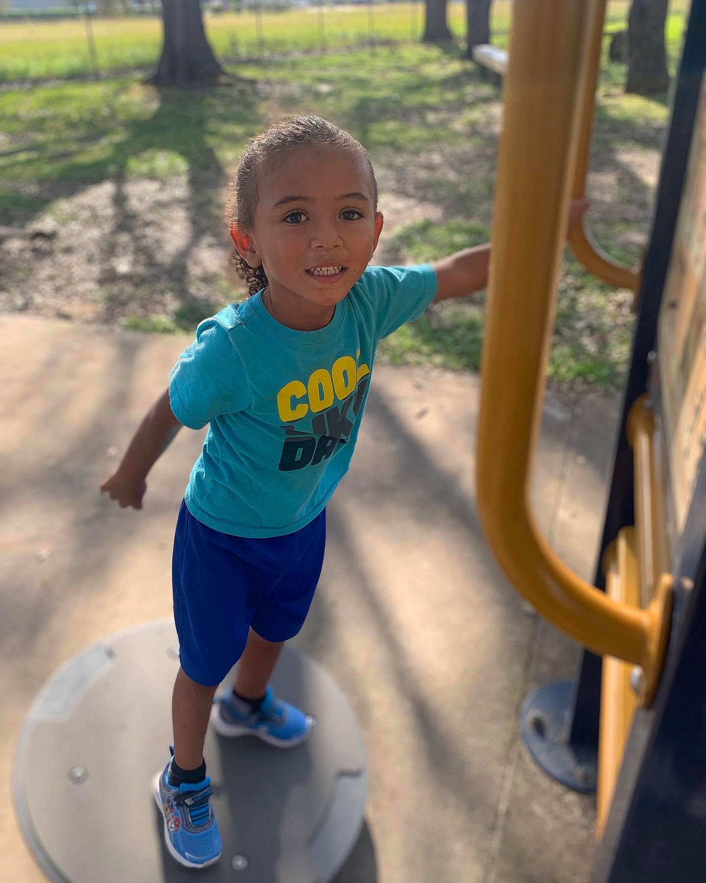 Jaxson joined the competition — help win amazing prizes! blue, child, electric_blue, facial_expression, fun, grass, happy, joy, leisure, outdoor_play_equipment, outdoor_recreation, people_in_nature, person, plant, playground, recreation, shorts, smile, summer, t_shirt