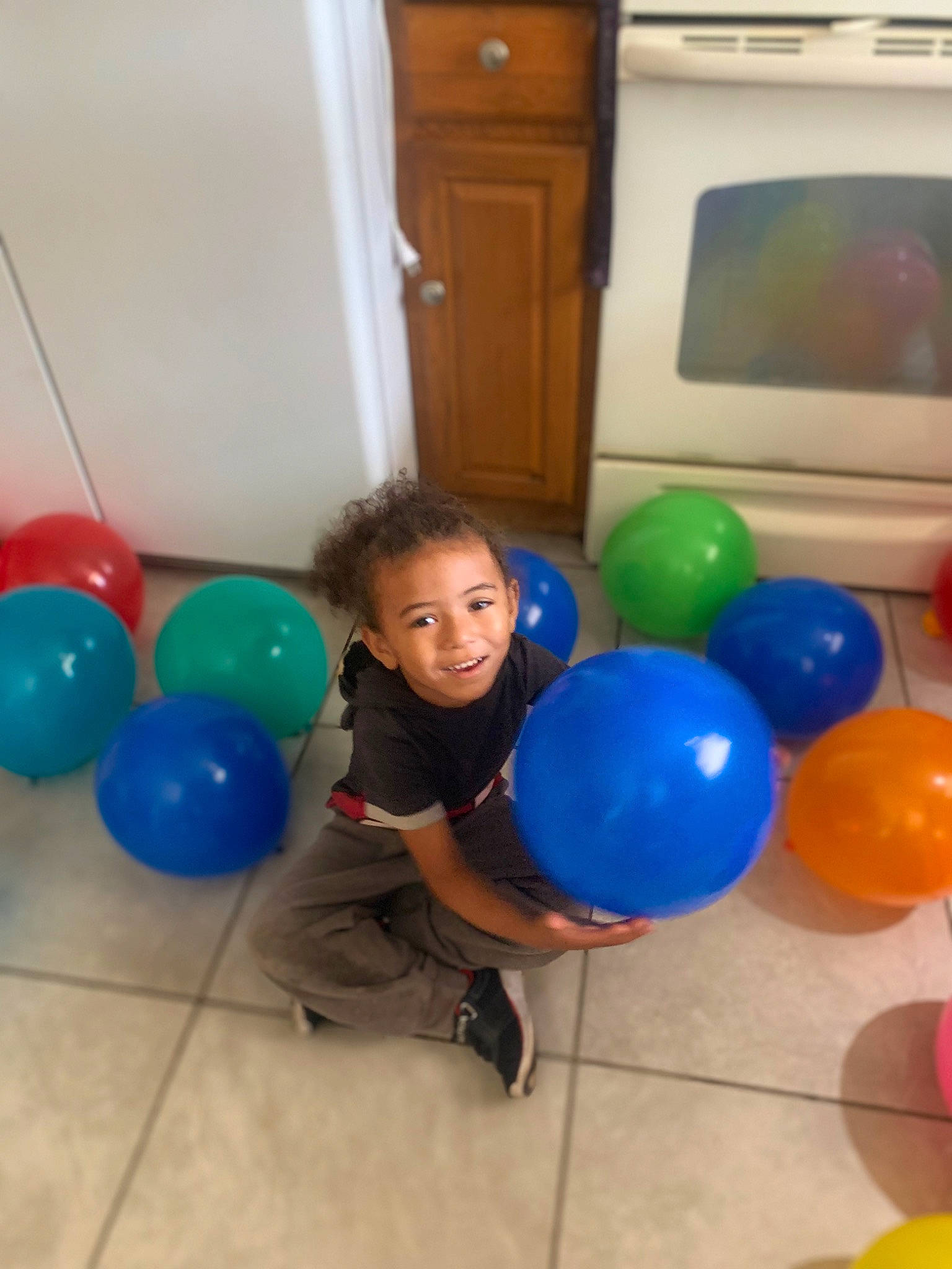 Jaxson joined the competition — help win amazing prizes! balloon, cabinetry, child, cupboard, drawer, electric_blue, event, flooring, fun, happy, joy, leg, leisure, party, party_supply, person, play, recreation, room, smile