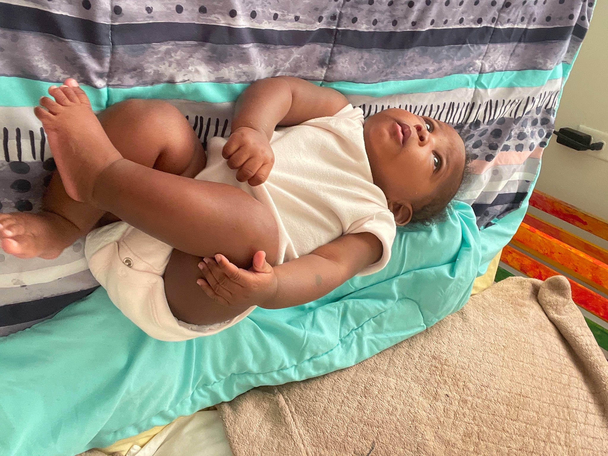 Promise is registered to the contest to win money with this photo: abdomen, baby, comfort, diaper, elbow, event, eye, health_care, hospital, human_leg, joint, knee, linens, medical, patient, person, skin, stomach, thigh, toddler