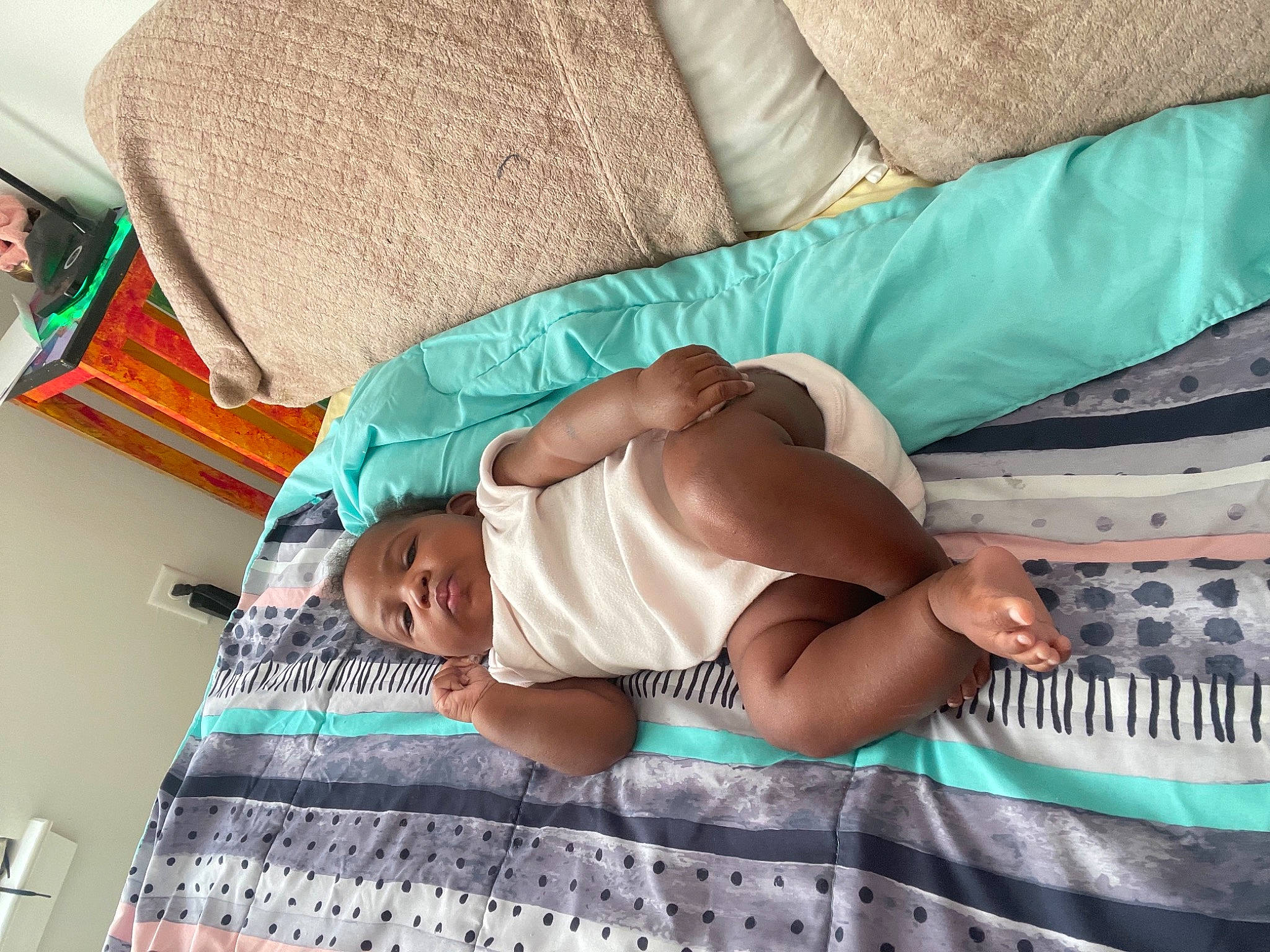 Promise is registered to the contest to win money with this photo: abdomen, baby, baby_products, bed_sheet, bedding, bedtime, chest, child, comfort, elbow, human_leg, knee, linens, nap, pattern, person, room, textile, thigh, toddler