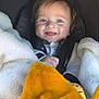 Tidjani a rejoint le concours — aidez-le/la à gagner de superbes lots ! baby, child, smiling, blanket, car_seat, blue_eyes, happy, cozy, warm, infant, cute, face, clothing, indoor, portrait, young_child, baby_boy, soft_blanket, comfort, expression