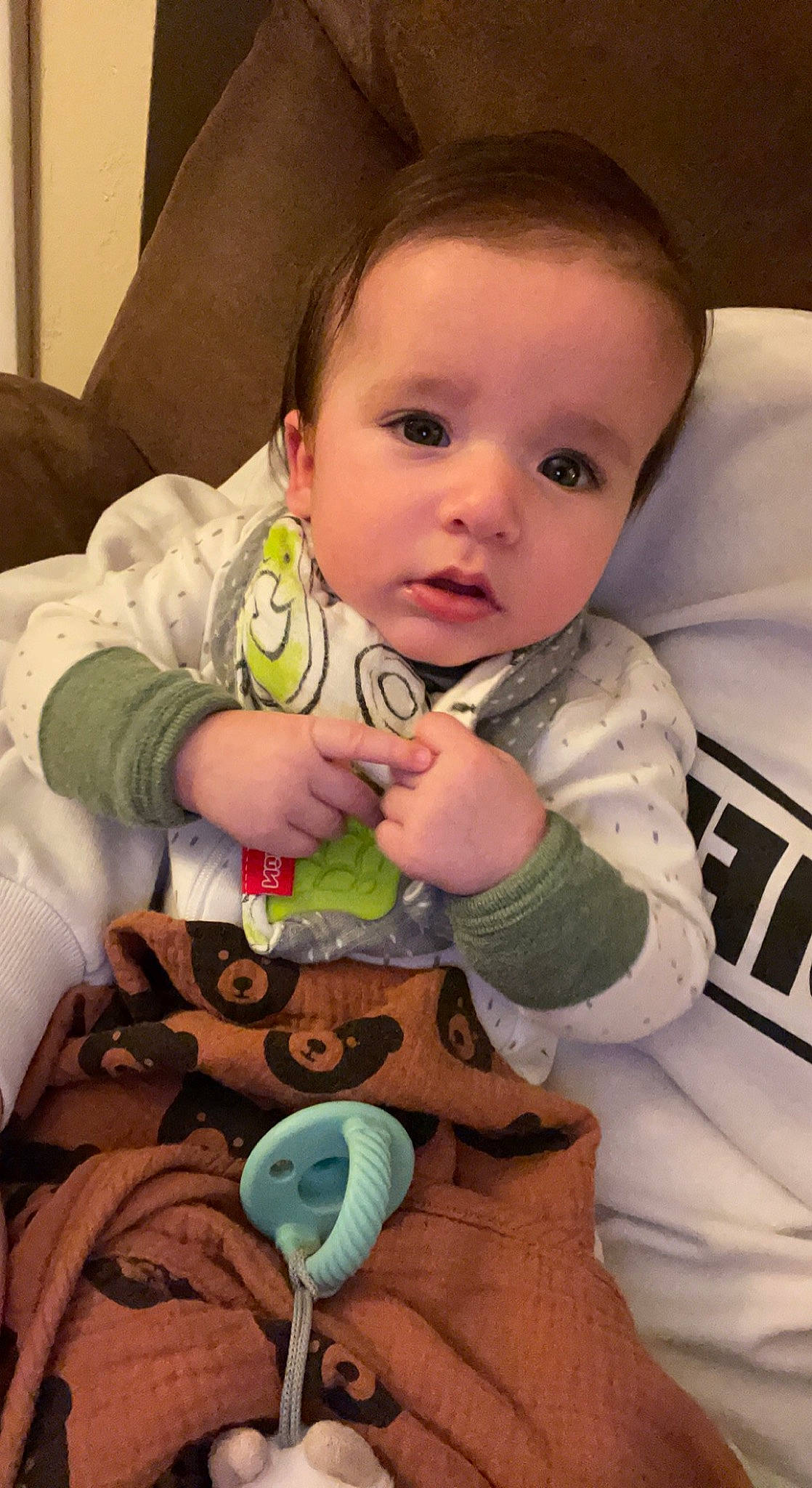 Luca is registered to the contest to win money with this photo: baby, baby_toddler_clothing, cheek, child, chin, comfort, face, facial_expression, finger, head, iris, linens, mouth, nail, neck, nose, person, skin, sleeve, thumb