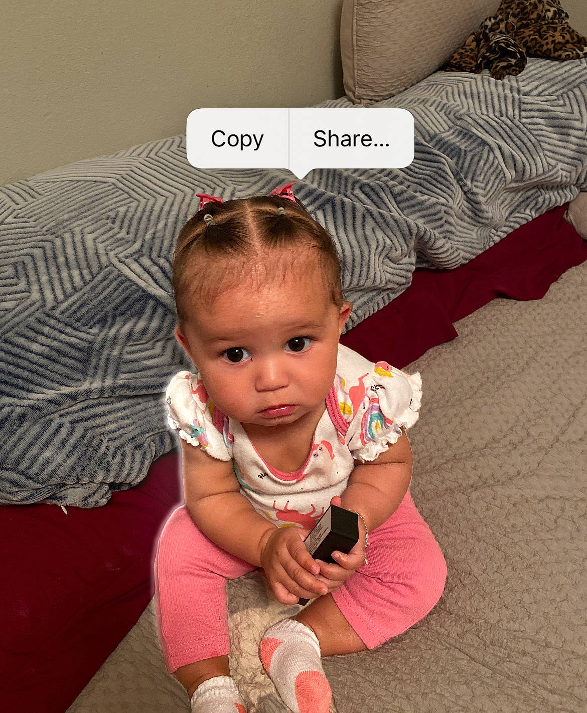 Nova is registered to the contest to win money with this photo: baby, baby_toddler_clothing, cheek, child, comfort, eye, flooring, font, foot, hair, happy, human_leg, linens, magenta, person, pink, sitting, sleeve, sock, thumb