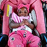 apparel, baby, car_seat, child, clapping, cushion, cute, happy, headband, headwear, indoors, infant, mickey_mouse, person, pink_clothing, playful, portrait, seat, smiling, young_child