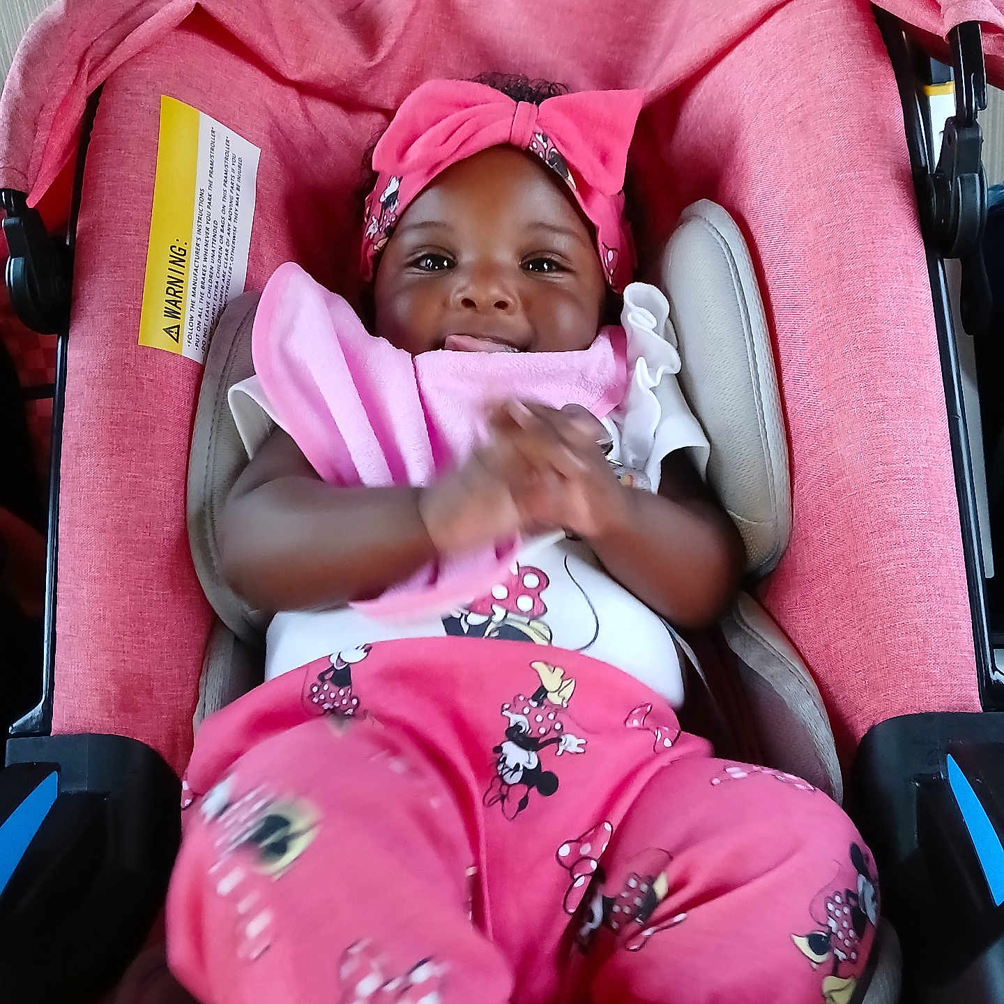 Kreari joined the competition — help win amazing prizes! apparel, baby, car_seat, child, clapping, cushion, cute, happy, headband, headwear, indoors, infant, mickey_mouse, person, pink_clothing, playful, portrait, seat, smiling, young_child