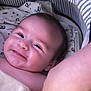 baby, bassinet, blanket, child, closeup, comfort, cozy, cute, face, happy, indoors, infant, lying_down, newborn, peaceful, portrait, skin, smiling, soft, striped